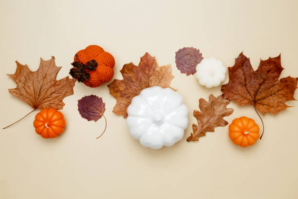 istock Autumn composition with maple leaves, decorative pumpkins and candles. Top view. Copy space 2167574640