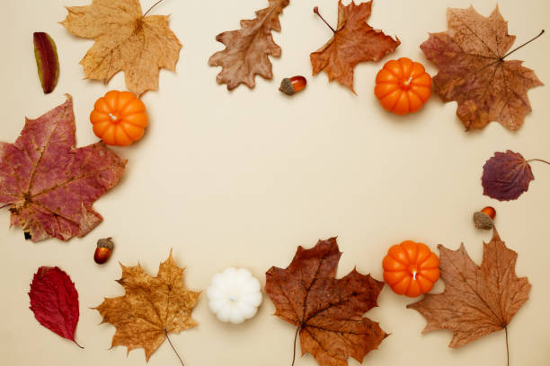 istock Autumn composition with maple leaves, decorative pumpkins and candles. Top view. Copy space 2167574656