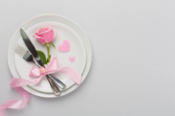 istock Festive table setting for Valentine's Day on color background, top view 2167579239