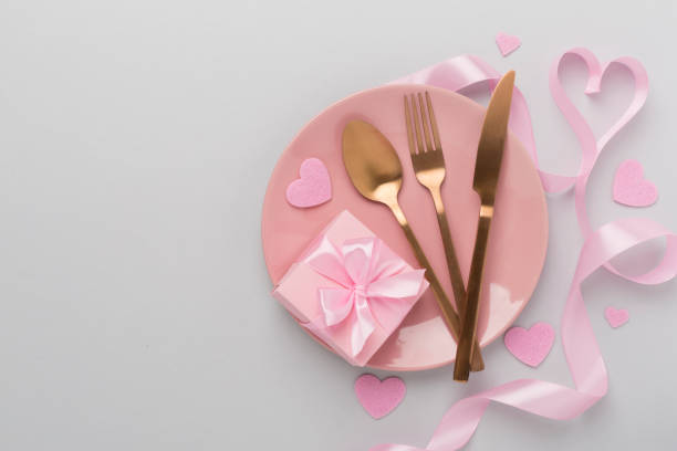 istock Festive table setting for Valentine's Day on color background, top view 2167579254