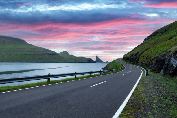 istock Dramatic evening view of road and Tindholmur cliffs 2167580673