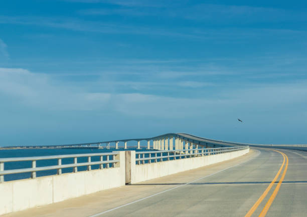 Shot through the windshield of a moving car of the Marc Basnight Bridge that connects Bodie and Hatteras, Islands in Outer Banks, North Carolina, USA over the Oregon Inlet.