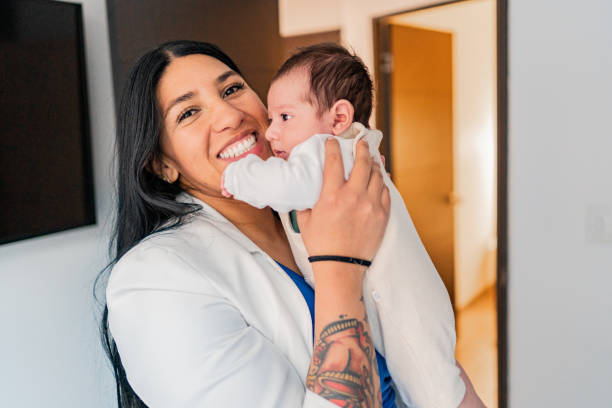 Mother with newborn son at home