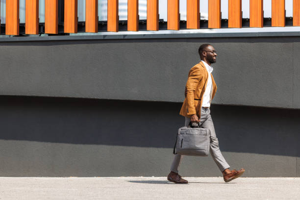 istock Confident businessman walking in an urban setting 2167583810