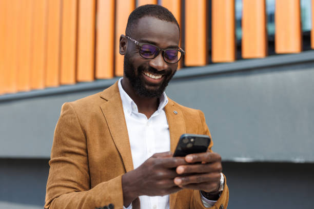 istock Confident businessman using smart phone in urban setting 2167583886