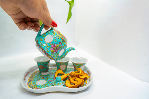 istock Dehydrated Dried Apple Fruit with Tea pouring served in the afternoon dry fruit snack with green tea 2167584551