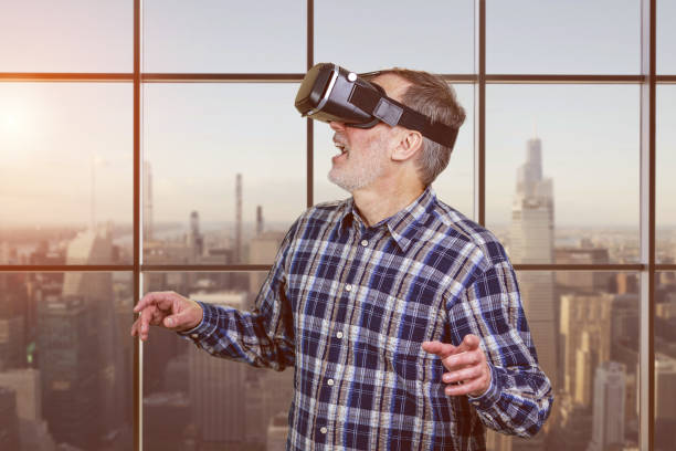 Portrait of excited elder man in vr headset. Checkered window background.