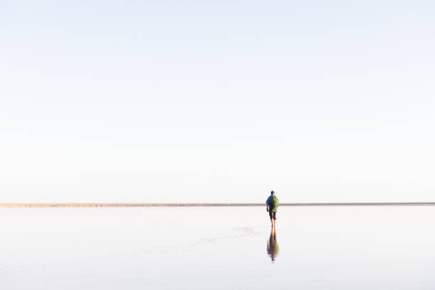 istock Tranquil minimalist landscape with lonely man 2167587104
