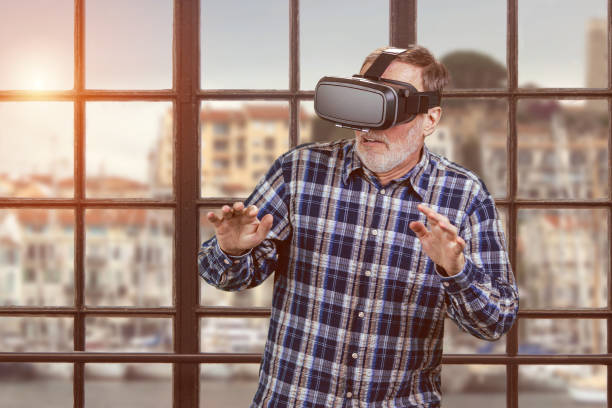 istock Portrait of scared elder man in vr headset. 2167587799