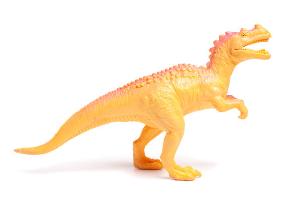 istock Yellow dinosaur toy isolated on white background. 2167590227