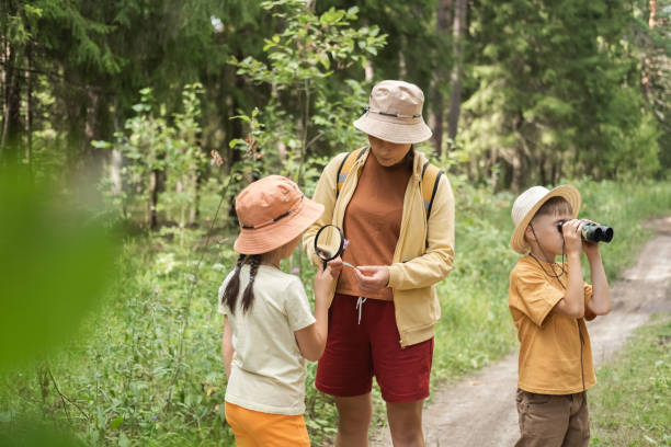 istock mom and kids are exploring the forest. 2167590357