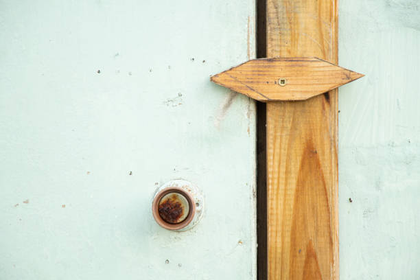 Old door with handle and lock from a barn at a dacha in Ukraine, door as a background