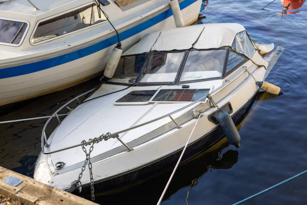 istock Small Submerged Boat Tied at Marina 2167591948