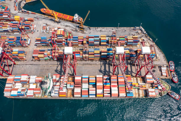 istock Aerial view of Drone view of a container ship in loading/unloading at port. Containers on a vessel. Global market. Cargo shipping. Logistic 2167595596