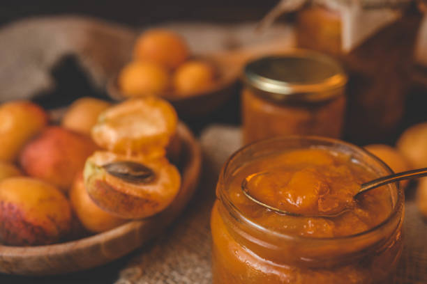 Jar of organic craft apricot jam.