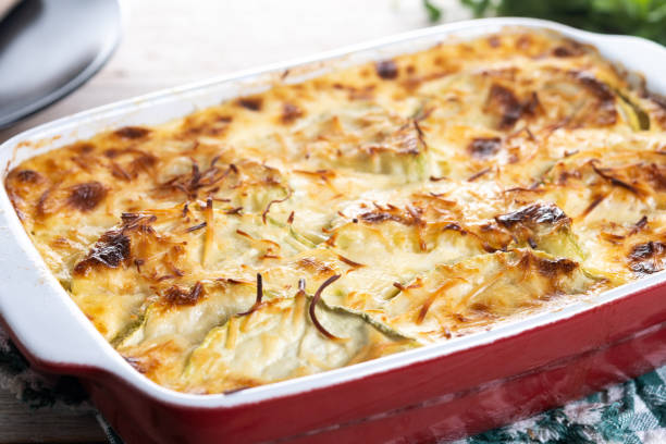 istock Casserole with cheese and gratin zucchini isolated on white background 2167600430