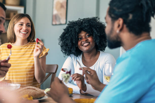 istock Group of friends having meal at home 2167601085