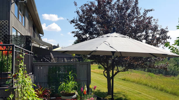istock Summertime Garden Patio With Sun Umbrella 2167602067