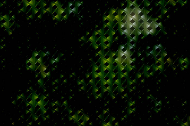 An abstract image featuring a geometric pattern with green and black triangular shapes. The design creates a sense of depth and texture, with light reflecting off the surfaces, giving the image a three-dimensional effect.