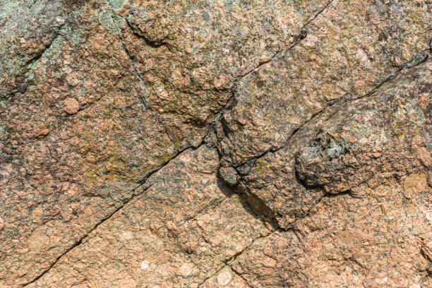 istock Texture of natural stone, boulder with diagonal cracks and relief convex surface. Nature abstract background 2167603935