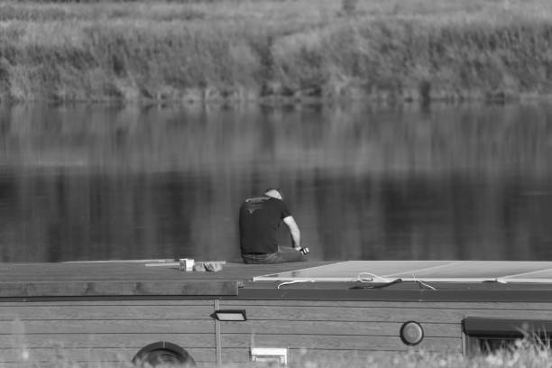 Man holding a fishing rod at sea