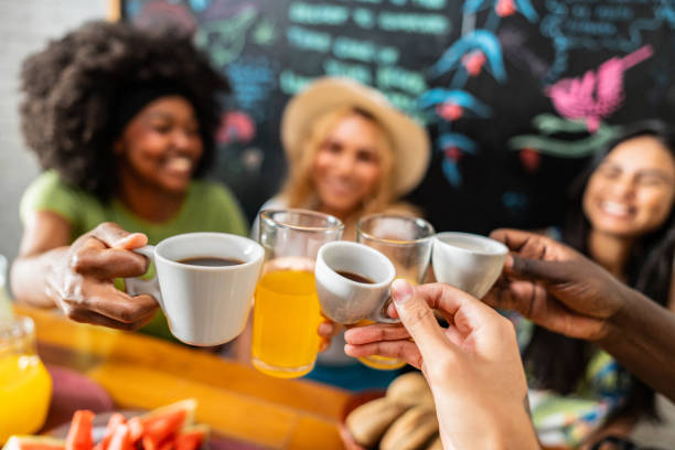 istock Friends toasting during breakfast at a hostel 2167604744