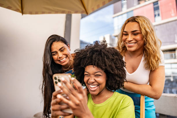 istock Friends using the mobile phone at a hostel 2167604793