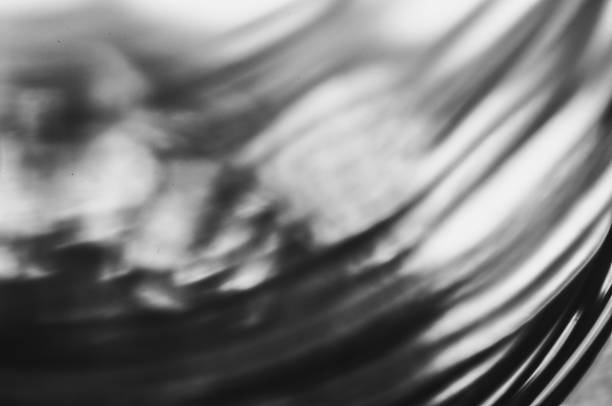 Close-up macro of a thin wire backlit in black and white abstraction macrophotography