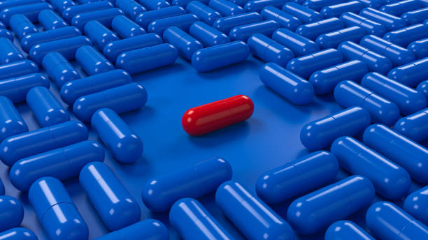 istock Red pill in blue medicines pills capsules geometric pattern background. 3d illustration 2167605554