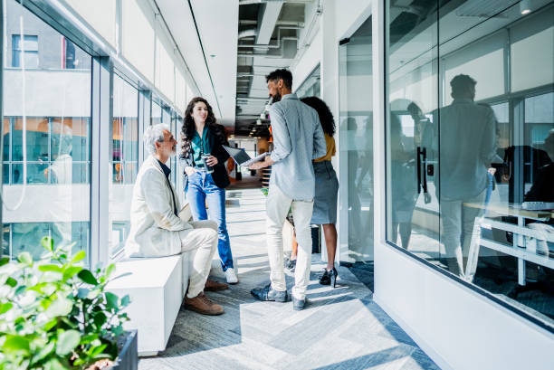 istock Coworkers talking at coworking 2167605557