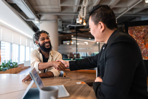 istock Mid adult man doing a interview with candidate at coworking 2167606747