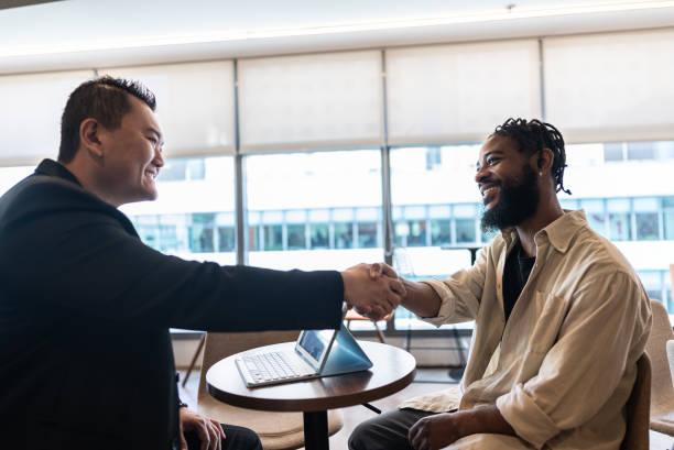 istock Mid adult man doing a interview with candidate at coworking 2167606761