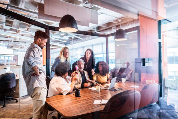 istock Coworkers talking during meeting at office 2167607515