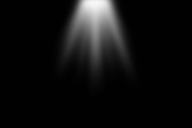 istock Vertical spotlight beam. A bright beam of light illuminating a dark background, creating a dramatic contrast and a sense of focus. 2167607590