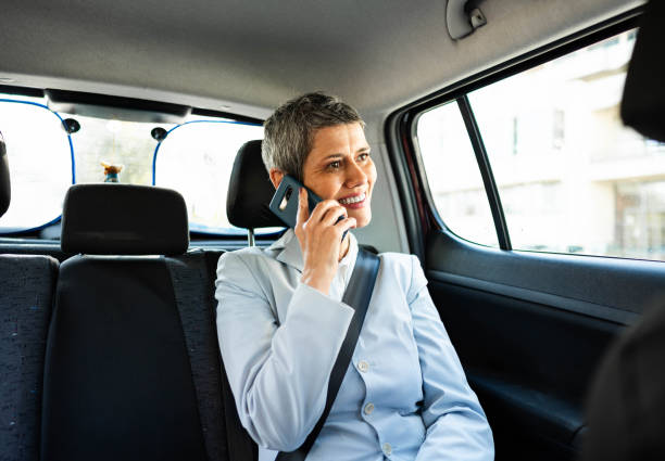 istock Businesswoman having phone call while sitting in a car 2167607873