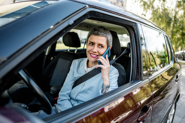 istock Businesswoman having phone call while sitting in a car 2167608304