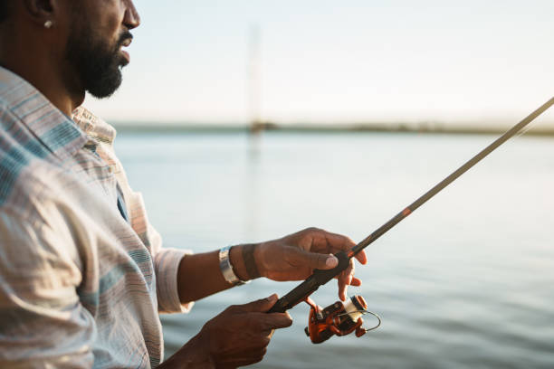 istock Black man fishing at the river 2167609868