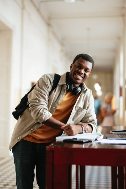 istock Confident University Student Smiling in a Bright Hallway 2167617591