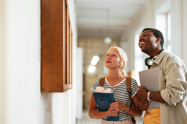 istock University Students Engaging in a Bright Academic Corridor 2167617599