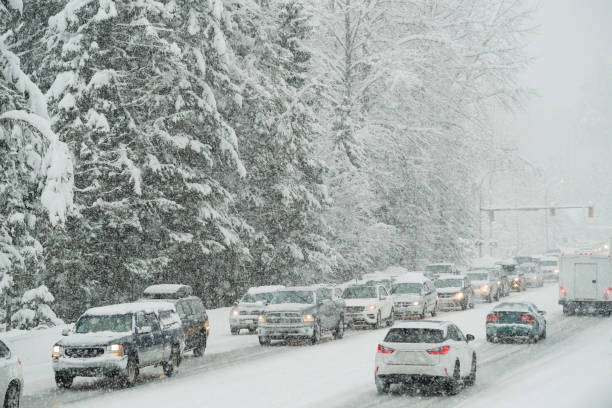 istock Traffic line up in winter storm 2167618379