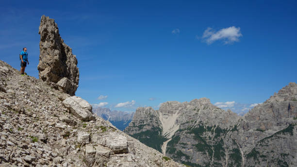 istock Male hiker explores mountains in summer, Dolomites 2167620606