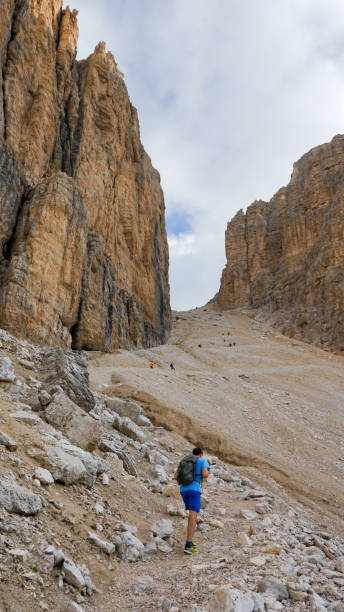 istock Male hiker explores mountains in summer, Dolomites 2167621528
