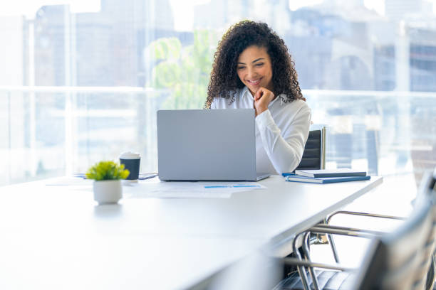 istock Young woman working on a laptop computer in the office. 2167622627