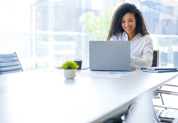 istock Young woman working on a laptop computer in the office 2167622654