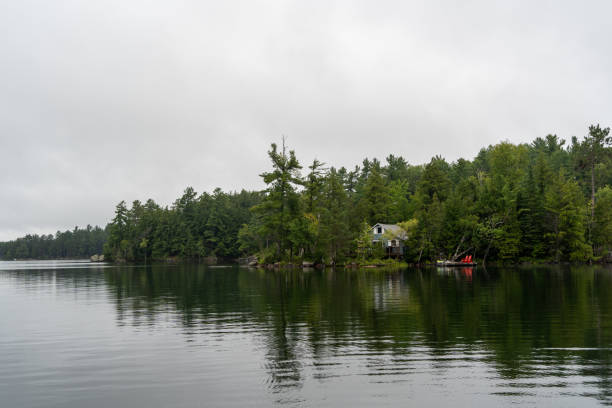 Chalet by a lake in the forest in Apsley, Chando Lake, Ontario, Canada.
