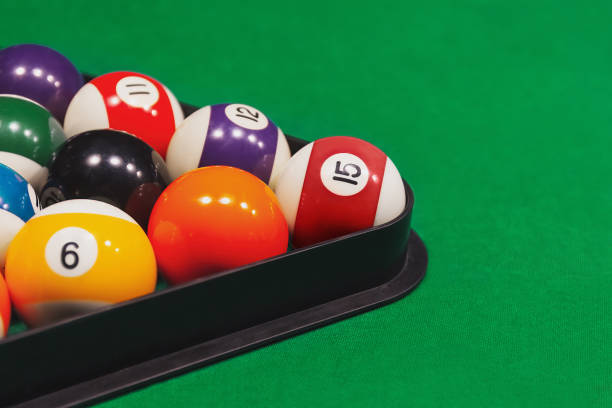 istock Colorful billiard balls with rack on green table. Copy space. 2167624196