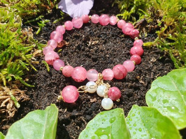 istock Bracelet with pink quartz in a garden 2167633789