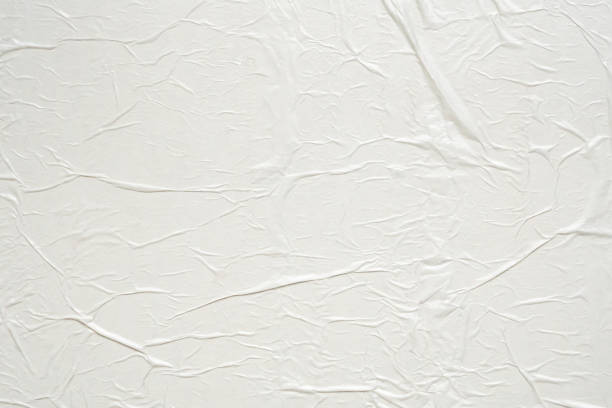 istock White blank crumpled and creased paper poster texture background 2167641303