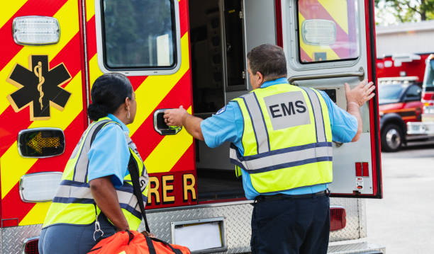 istock Paramedics opening back doors of rescue ambulance 2167656725