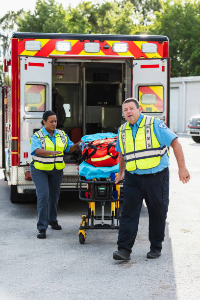 istock Paramedics with gurney outside back doors of ambulance 2167656765